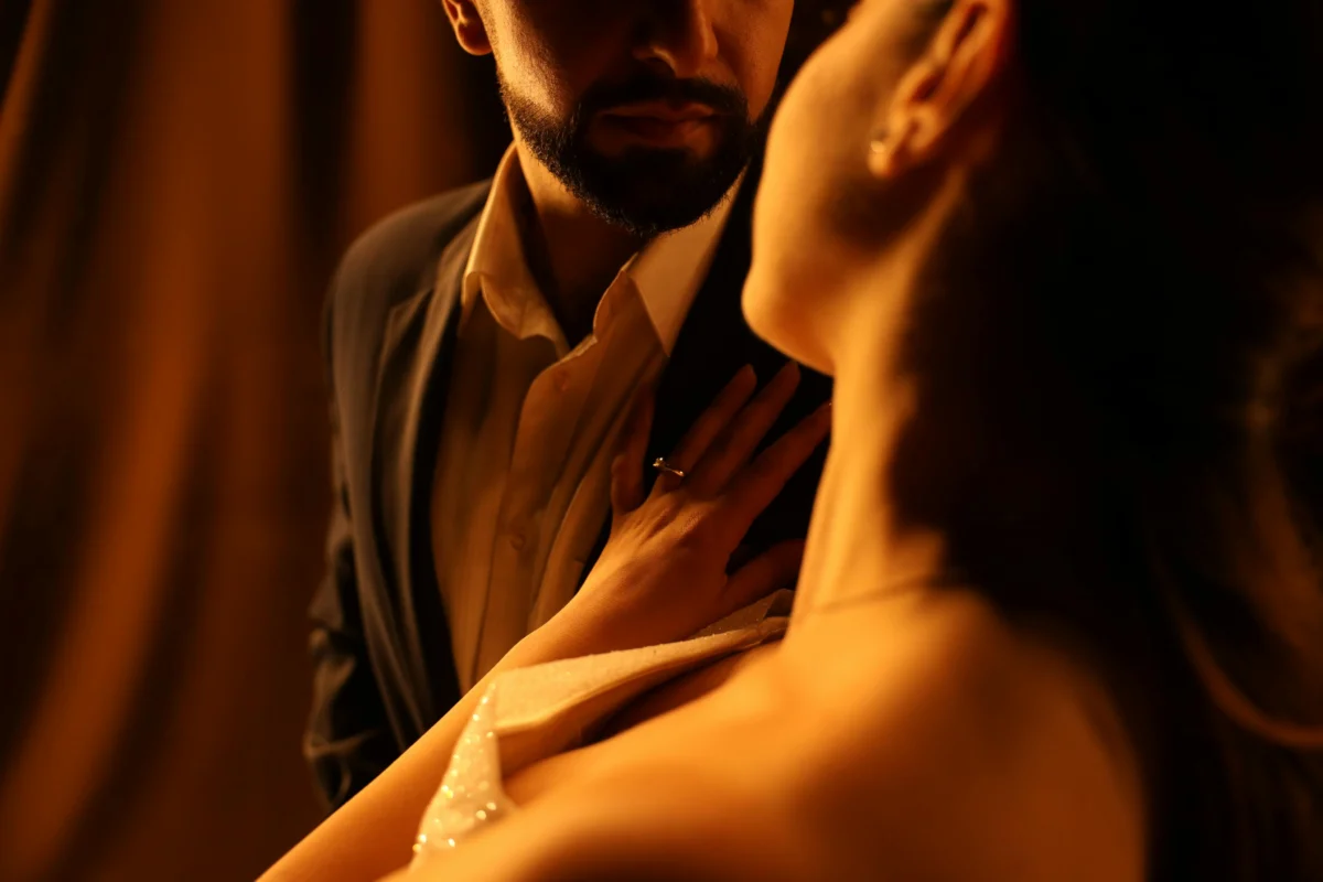 A couple in a warm, intimate embrace, captured in soft lighting, evoking romance.