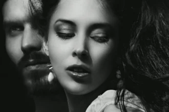 Dramatic black and white portrait of a couple, expressing emotion and intensity.