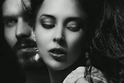 Dramatic black and white portrait of a couple, expressing emotion and intensity.