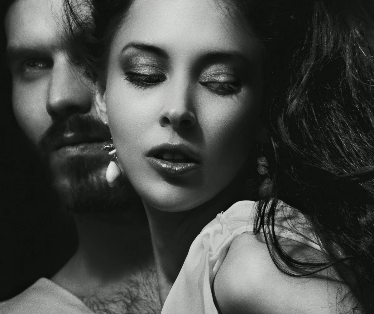 Dramatic black and white portrait of a couple, expressing emotion and intensity.